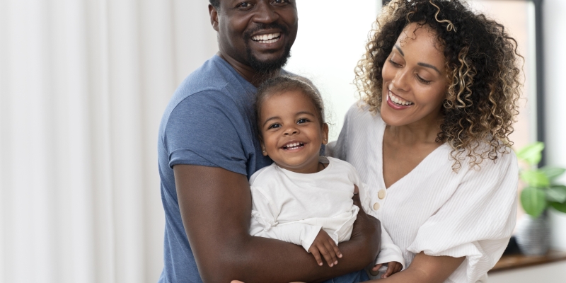 parents-spending-time-with-their-little-daughter-home